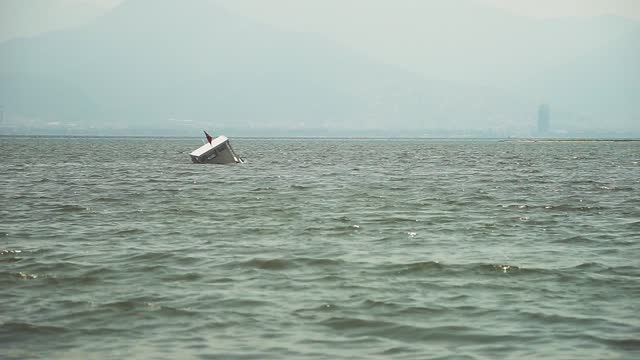 A Half Sunken Boat at Windy Sea
