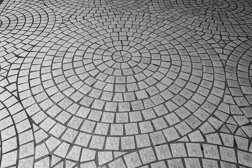 Close-up of Irregular Tile Flooring in the Street