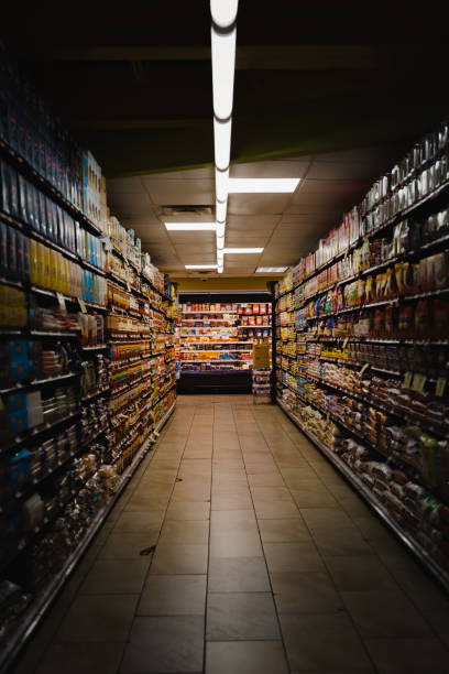 istock Goods on the supermarket shelf in long aisles 1499702004