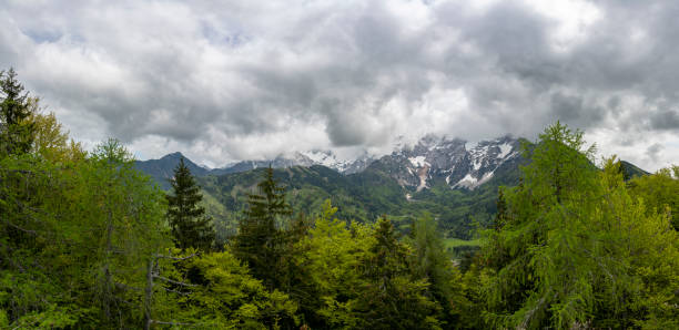 Zgornje Jezersko valley in Slovenia during a beautiful springtime day with the mountain range around the Grintovec mountain peak in the Kamnik–Savinja Alps.