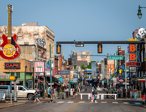 Memphis, Tennessee, USA. 6 June 2023. Beale Street, Memphis in the day time with signs for bars and music venues. Smaller numbers of visitors than at night.