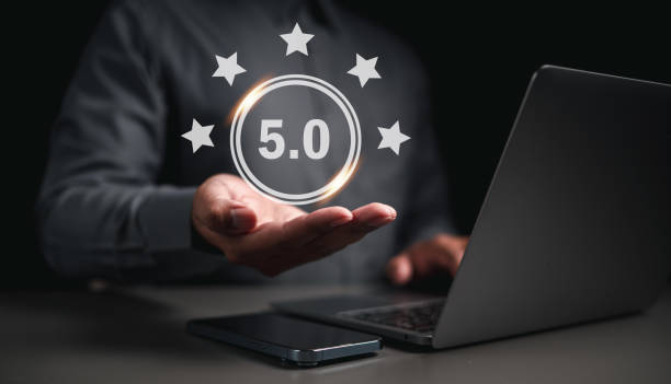 istock Businessman on hand  get rewarded five star emoticon on virtual touch screen. User comment and feedback for review. 1499705824