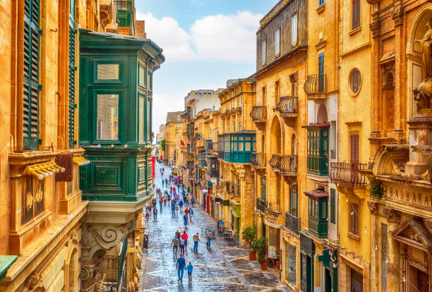High Angle View of Republic Street in Valletta Church of Saint Barbara on the right, Valetta, Malta malta stock pictures, royalty-free photos & images