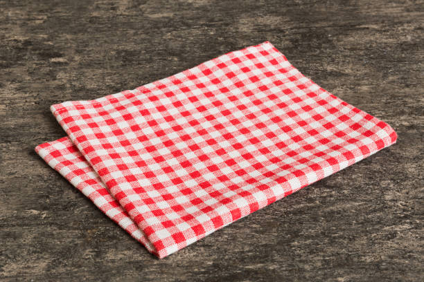 istock top view with red empty kitchen napkin isolated on table background. Folded cloth for mockup with copy space, Flat lay. Minimal style 1499708119