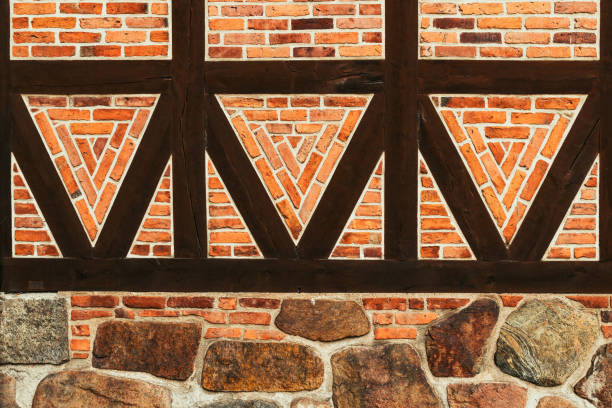 istock Half-timbered old house wall, brick wall pattern with joist timber framework. Detail from town of Halmstad in Sweden. 1499712207