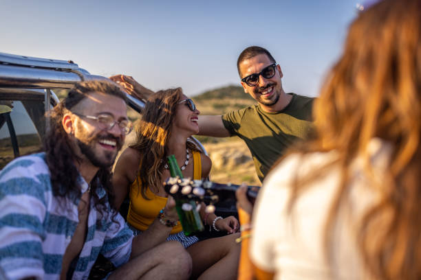 istock Friends enjoying on a road trip in their car 1499713652