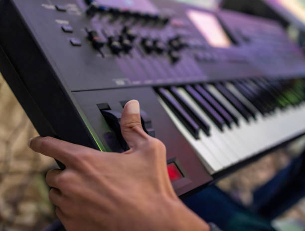 istock Musician black finger playing classical music at the piano 1499713879