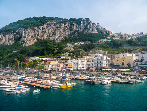 Capri Island, Naples, Italy - June 28, 2021: Aerial view of  Marina Grande the main port on the island, moored ships