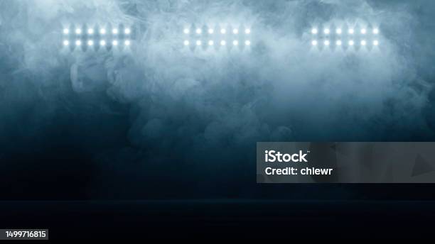 Bright Stadium Arena Lights Smoke Bombs Empty Dark Scene Neon Light Spotlights The Concrete Floor And Studio Room With Smoke Float Up The Interior Texture Night View For Display Products Stock Photo - Download Image Now