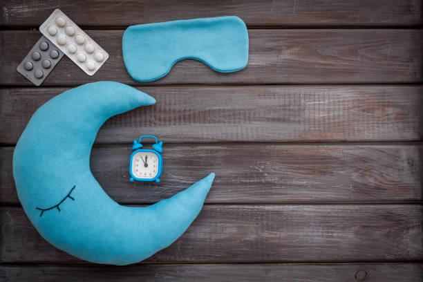 istock Sleeping pills and moon pillow for good night. Insomnia concept 1499717688