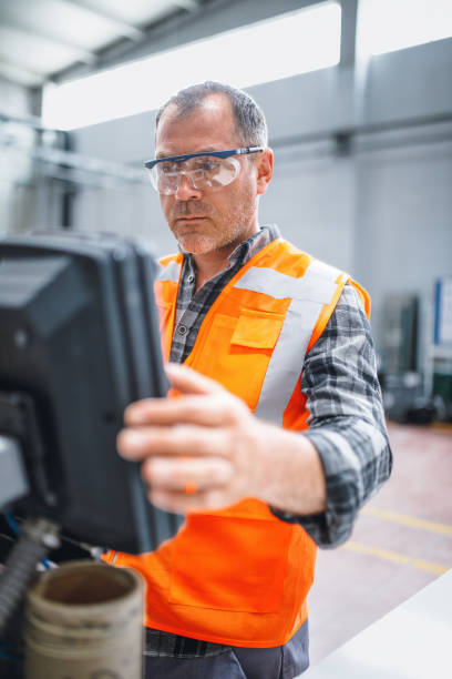 istock Manual worker man working at manufacturing factory 1499718188