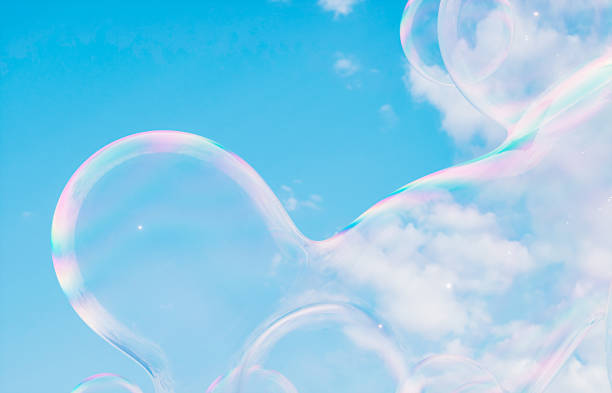 istock Abstract 3d art with holographic soap bubbles floating on sky background. fluid. liquid blobs. 1499721922
