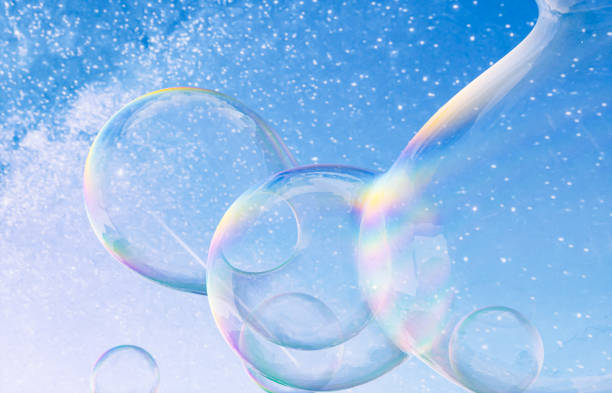 istock Abstract 3d art with holographic soap bubbles floating on sky background. fluid. liquid blobs. 1499722014