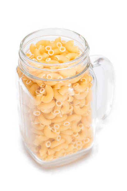 istock Uncooked Chifferi Rigati Pasta in Glass Jar Isolated on White 1499722207