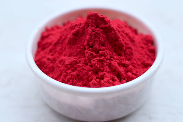 Gulal (Colored Powder) on white background, Holi festival, India.