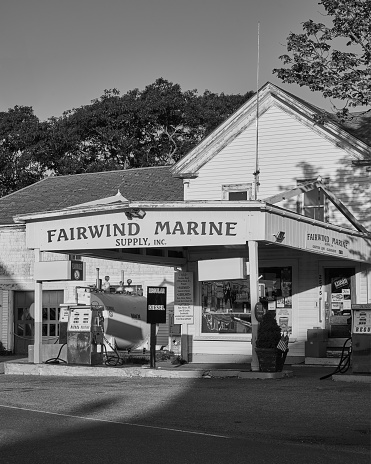 Fairwind, United States – August 23, 2021: A grayscale shot of a Fairwind Marine gas station in the daylight