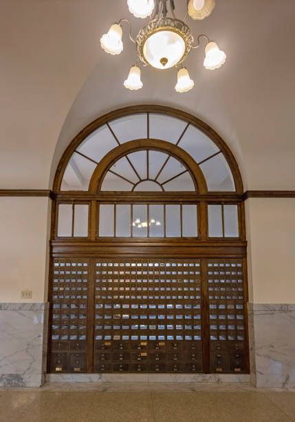 istock Old Mail Boxes with a Light Fixture above in Havre 1499726536