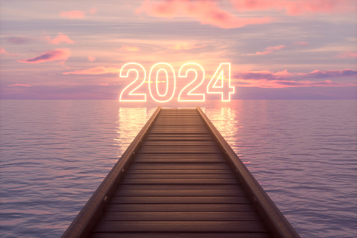 Wooden pier over the sea towards 2014 with neon lights. Digitally generated image.