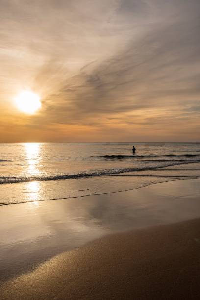 istock Tranquil sunset view of a beach with sand and water 1499728119