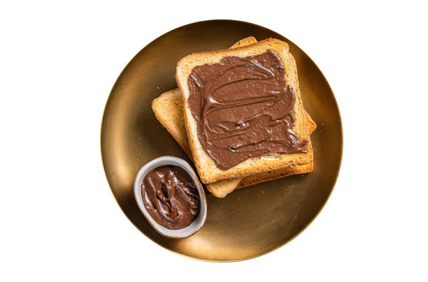 Stack of Toasts with chocolate Hazelnut cream in plate.  Isolated on white background.