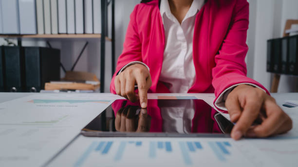 istock Excited Asian bookkeepers doing bookkeeping, accounts payable, assets, book value, equity, inventory, liabilities, cost of goods sold, depreciation, expenses, Gross profit, diversification, liquidity 1499729274