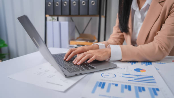 istock Excited Asian bookkeepers doing bookkeeping, accounts payable, assets, book value, equity, inventory, liabilities, cost of goods sold, depreciation, expenses, Gross profit, diversification, liquidity 1499729310