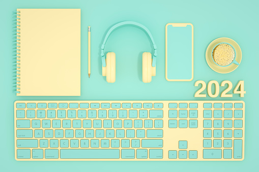 2024 new year, blank page notebook and keyboard on turquoise colored background. Digitally generated image.