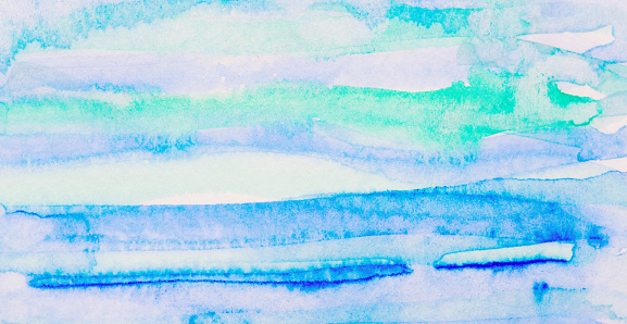 Colorful, abstract striped brushstrokes of watercolor paint.