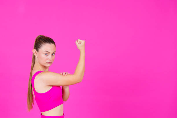 istock Strong woman isolated on pink background 1499730788
