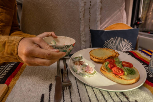 istock Man preparing food inside his camper van. Camping concept 1499730790