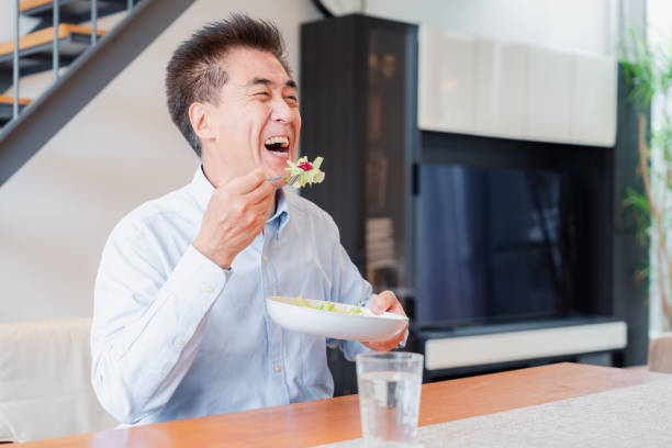 istock An elderly man enjoying a salad 1499731061