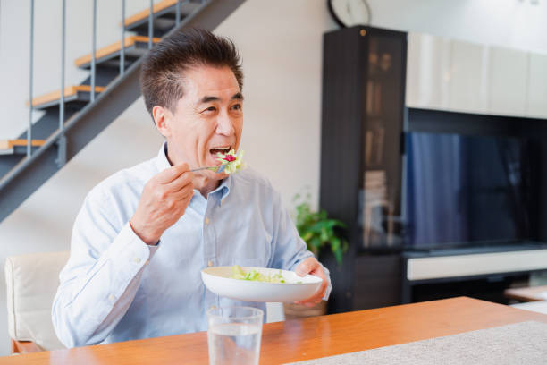 istock An elderly man enjoying a salad 1499731066