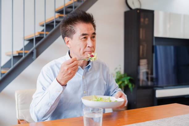 istock An elderly man enjoying a salad 1499731068