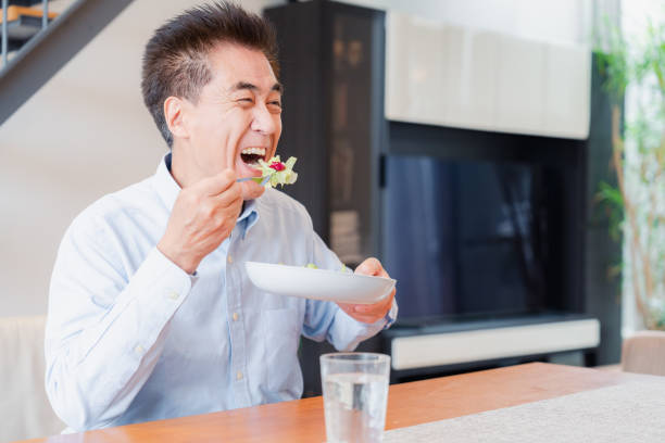istock An elderly man enjoying a salad 1499731079