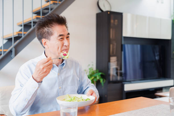 istock An elderly man enjoying a salad 1499731095