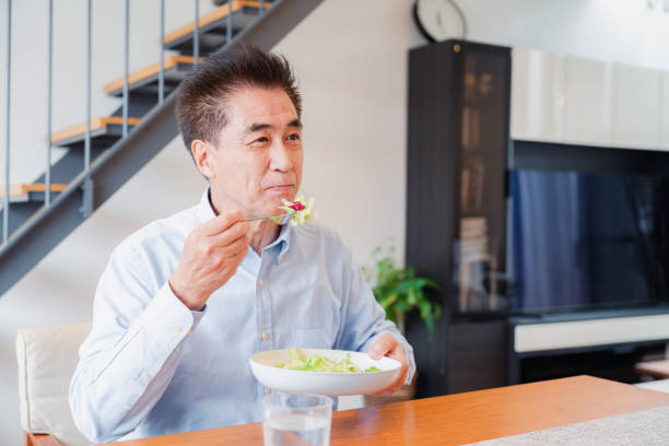 istock An elderly man enjoying a salad 1499731096