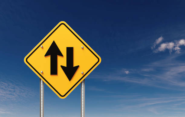 istock Two Way Street Sign Before Blue Sky 1499733628
