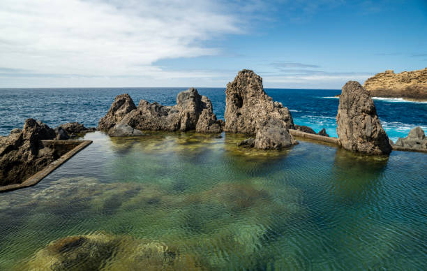 istock Blue sea waves. Hidden azure bay vertical image 1499735614
