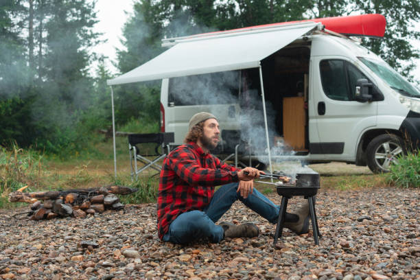 istock Man barbecuing near the camper van in Norway 1499736546