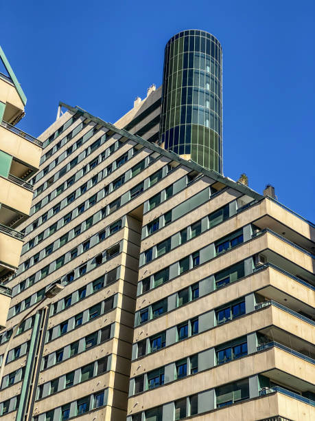 istock High section of modern building against clear sky 1499736548