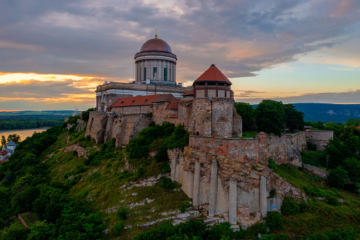 Aerial view about the Castle of Esztergom with the famous Basilica and cloudy sunset at the background