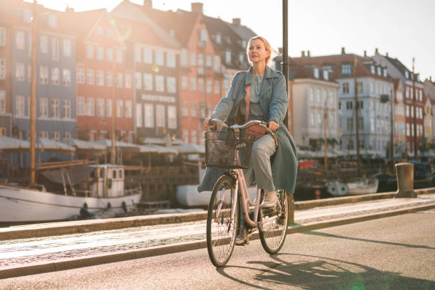 istock Beautiful Caucasian Female Discovers Copenhagen's Riverside Gems on Two Wheels 1499740002