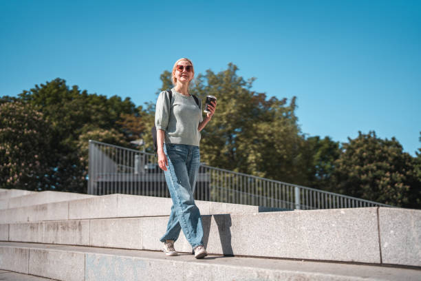 istock Copenhagen's Coffee Wonders: Relaxed Caucasian Woman's To-Go Experience 1499740528