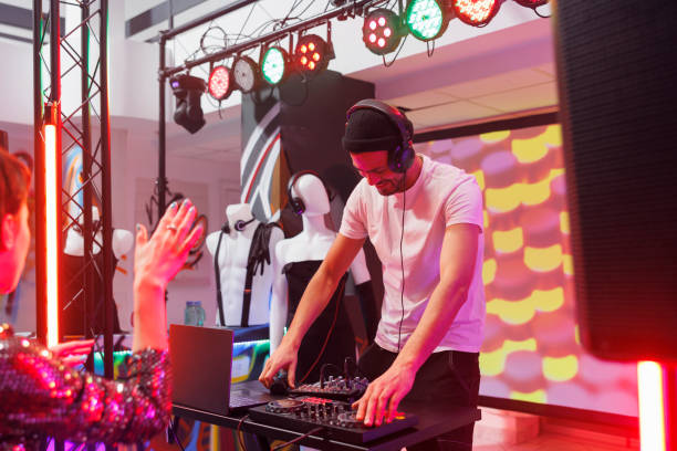 istock Dj mixing electronic tracks in club 1499743029
