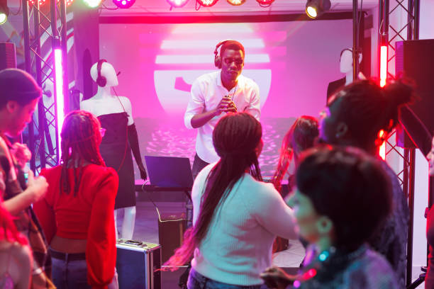 istock Dj mixing music in nightclub 1499743050