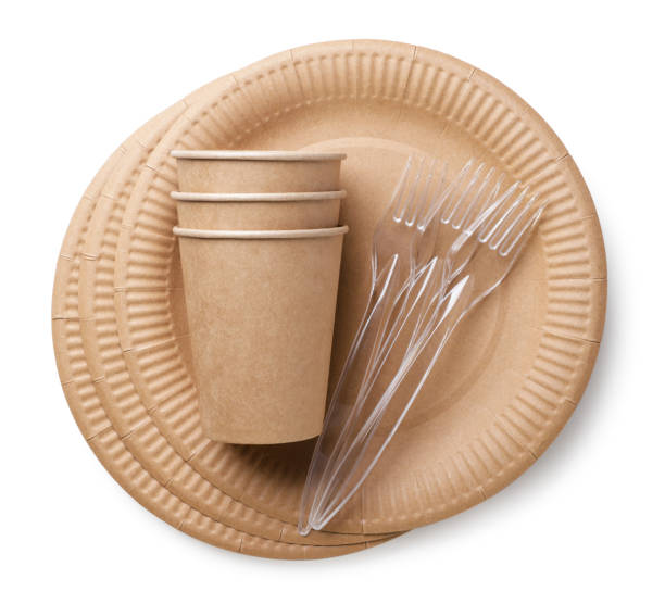 istock Disposable tableware. Plates, cups and forks on a white background. Top view 1499743469