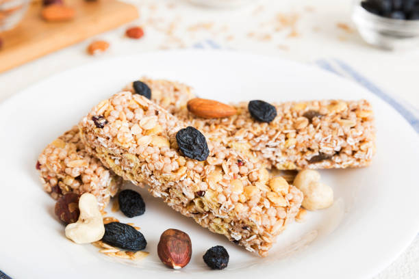 istock Various granola bars on table background. Cereal granola bars. Superfood breakfast bars with oats, nuts and berries, close up. Superfood concept 1499747157