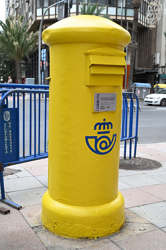 Alicante, Spain, june 7, 2023 : Spanish post mailbox on a street in Alicante