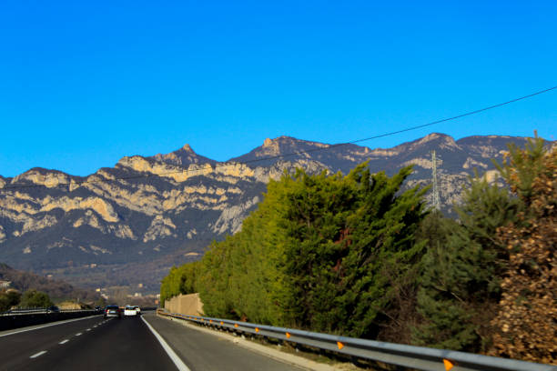 A road with mountains in the background