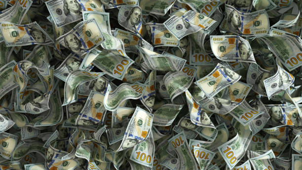 istock 3D rendering of lots of 100 us dollar notes spread on surface. money background 1499752792